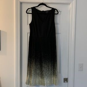 Beautiful black and gold sleeveless dress.